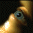 Pixelated image showing a close-up of a character's eye and hand with text "KILL BILL VOL. 1" on the right side.