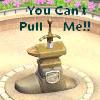 A stone fountain with a sword embedded in its top, surrounded by a circular basin, with text above reading "You Can't Pull Me!!" in green pixelated letters.