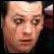 A four- with a pixelated image of a person in the top-left and text below, displaying red and black pixelated text on white backgrounds