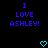 Blue pixelated text reads "I LOVE ASHLEY!" on black background with two cyan heart symbols below.