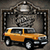 Pixelated static image of a yellow sedan with silver roof parked in front of dark stone building facade.