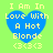 Four identical pixelated heart-shaped icons with yellow text on blue hearts against a green background, each displaying "I Am In Love With A Hot Blonde <3<3<3".