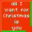 Red square with green border displaying white text 'all I want for Christmas is you' and a small green heart or star symbol in the bottom-right corner.