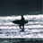 Animated sequence showing a surfer silhouette on waves with heart symbols appearing and changing in the foreground.