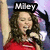 A four- shows a woman in red clothing holding a microphone, with text overlays changing
