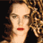 Static 48x48 pixel icon showing a close-up of a woman's face with curly brown hair, red lips, and light skin tone against a dark background.