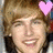 Pixelated image of a person with light brown hair and a pink heart icon on the right side, next to a black heart icon.