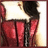 A pixelated figure in red pants and a dark top stands with back turned, holding a white rectangular object against a light background.