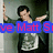 A person in a dark jacket and white shirt poses with arms raised, partially obscured by blue text overlay.