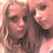 Two people with light brown hair appear in a small square image on a bright cyan background with pixelated pink text.