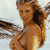 Static pixelated image of a woman in a bikini on a beach with water and sky background.