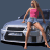 Pixelated image of a woman in a pink top and light blue shorts leaning on a silver car with dark windows against a solid gray background.