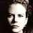 Pixelated grayscale portrait of a person with short hair against dark background, displayed as static buddy icon.