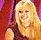 Pixelated image of a blonde woman in a dark dress with red X overlays, below which are two gray boxes containing red text "Hilary Duff" and "SUCKS".