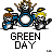 Pixel art of three cartoon drummers with brown, blue, and yellow hair playing drums under 'GREEN DAY' text on gray background.