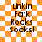 Orange and white checkered background with black text reading 'Linkin Park Rocks Socks!' in four vertical lines, two instances of the same text block side-by-side.