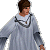 Pixelated character in light gray robe with dark shoulder straps stands against light gray background, next to green with bright green text
