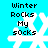Pixelated blue background with white snowflake and black text reading 'Winter Rocks My socks' in four identical