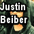 A pixelated image split into two sections: top shows a hooded figure with text 'Justin Beiber' and 'Is...', bottom shows flames with 'BAD!!!!' text.