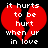 Red broken heart with white pixelated text reading "it hurts to be hurt when up in love" on black background.