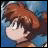 A pixelated anime-style character with brown hair and blue clothing on the left, next to a black background with white text reading "Anime IM" above smaller text "cOm" on the right.