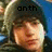 Pixelated image of a person with light brown hair and fair skin, wearing dark clothing against a blue background with partial text above.