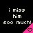 Black background with repeated white text 'i miss him soo much!' and pink triangular icons containing pixelated hearts.
