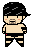Pixelated character with black hair, peach skin, and black shorts with red accents, standing against gray background.