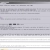 Static pixelated image with horizontal bands of gray and white, featuring small dark rectangular elements and faint pixel clusters.