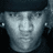 Two side-by-side pixelated portraits of a person with dark hair on the left and light skin wearing a blue cap on the right.
