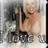 A pixelated image of a person holding an object, with visible text at the bottom and background elements.