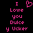 Pixelated pink text and a heart symbol on black background, with identical left and right sides showing 'I Love you Dulce y Ucker' in blocky font.