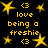 Yellow pixelated text and star shapes on a black background, with 'love being a freshie' repeated in multiple