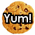Pixelated circular icon of a chocolate chip cookie with bold text "Yum!" overlaid in black and white.