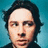 six shows a person with dark hair against a blue background, with text overlays changing