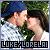 Pixelated image of two figures in close physical contact with blurred background, text at bottom reads 'LUKELORENAI' in blocky font.