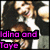 Two people in a close-up pose with dark hair and white tops, one person's face partially obscured by text overlays.
