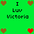 Green background with pixelated text and heart symbols arranged in a pattern, featuring brown and red hearts alongside 'I Luv Victoria' text