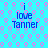 Blue background with pink and purple circular patterns, displaying four identical text blocks reading "i love Tanner" in blue pixelated font.