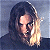A split-frame contact sheet showing a pixelated character on the left and green text logo on the right against gray background.