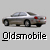 Four silver sedan cars with text labels, two labeled 'Oldsmobile' and two '$ 34,000', displayed in a