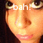 A pixelated close-up of a person's face with text overlays changing across frames, showing different phrases and a multiplication symbol.