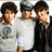 Three young men stand side-by-side on a white background, with blue text blocks surrounding them.