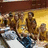 Pixelated image split into two sections: left shows a basketball court with players, right displays yellow text on blue background.