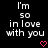 Black background with white pixelated text reading "I'm so in love with you" and two pink heart symbols at the bottom.