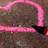 A static pixelated image shows a pink neon-like curved line with a horizontal segment, set against a brownish-gray textured background.