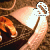 A pixelated image shows a person's arm holding a white object with brown patterns against a blurred background of warm tones.