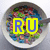 A circular bowl filled with colorful cereal pieces, featuring a yellow 'RU' text overlay on the left and black-and-white 'CEREAL' text on the right.