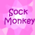 Pixelated text 'Sock Monkey' in purple on a pink gradient background with white starburst shapes.