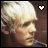 Pixelated profile of a person with light hair, showing two states: white heart symbol and teal heart symbol in top-right corner.
